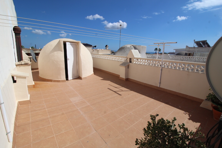 Bungalow adosado con solárium, vistas al mar y orientación este en Blue Lagoon – Villamartín