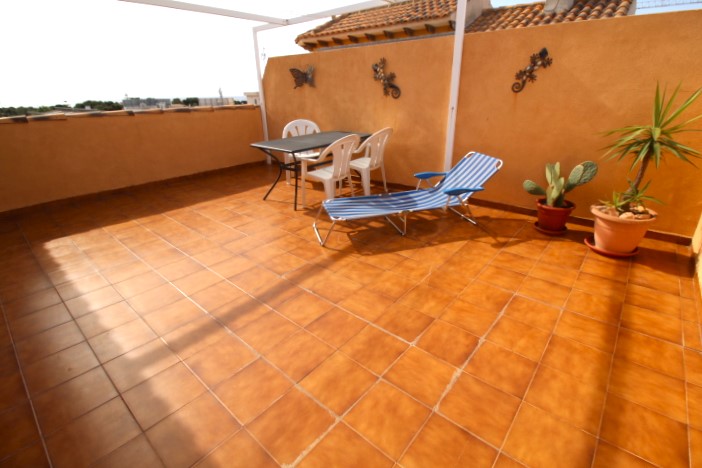 Top floor apartment in Punta Prima