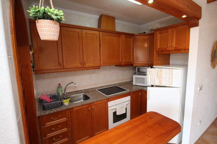 Encantador bungalow adosado de 2 habitaciones y 1 baño, con piscina comunitaria en Montegolf - Villamartin