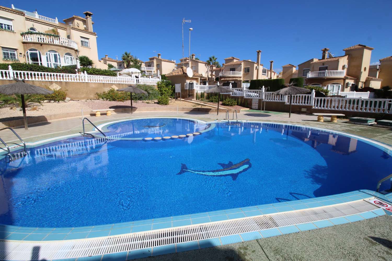 Quad-style bungalow with garden, terraces, swimming pool and sea views in Villamartín